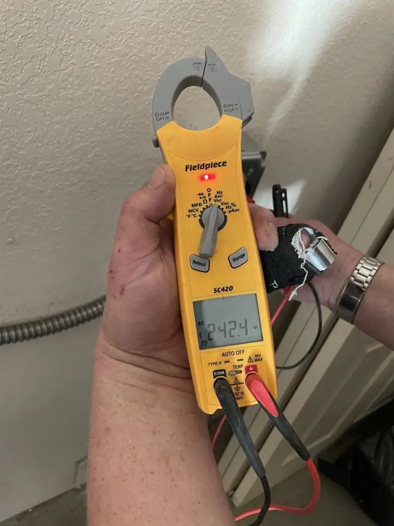 Voltage testing with clamp meter during Generator Installation in Bloomer